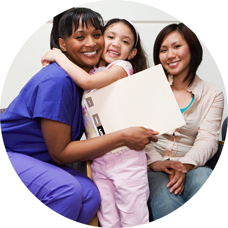 a female kid hugging a female nurse