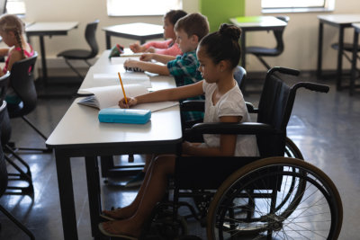 disabled schoolgirl with classmates