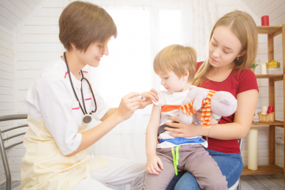 doctor injecting the baby