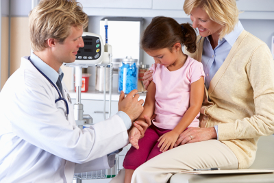 doctor giving child injection 