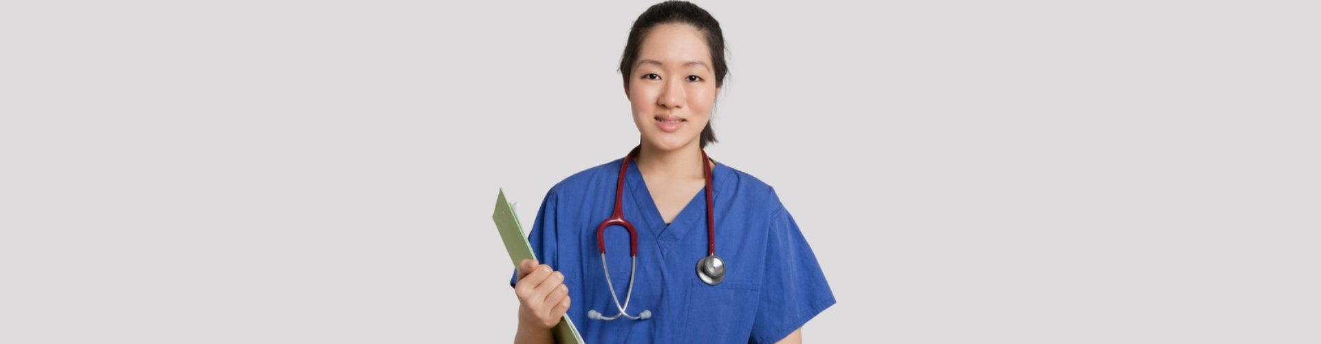 nurse holding a clip board